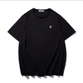 Minimalist black cotton T-shirt featuring a white embroidered letter R on the chest - M / Black With Embroidered Letter R