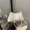 Handcrafted white woven shoulder bag with chic cylindrical strap for a minimalist look - White