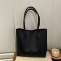 Minimalist black faux leather tote bag for women featuring a sleek matte finish and large capacity - Black