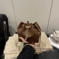 Brown woven texture bucket bag with gold chain strap and drawstring closure - Brown