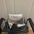 Silver shoulder bag with pink butterfly embroidery and metallic finish texture - Silver