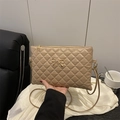 Elegant apricot quilted crossbody bag with gold metal bow and diamond stitch pattern - Khaki