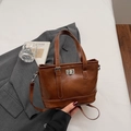 Braune PU-Leder Eimertasche mit Metall-Drehverschluss und verstellbarem Schultergurt - Braun