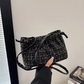 Borsa a secchiello in tweed nero da donna con trama dorata e chiusura a coulisse - Nero