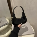 Minimalist black patent leather hobo bag with a glossy finish and gold metal hardware - Black