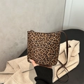 Chic leopard print bucket bag with brown leather strap and stylish vintage pattern - Leopard Brown