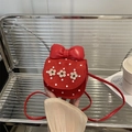 Kids red polka dot crossbody bag featuring 3D flowers and a large leather bow accessory - Red