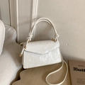 Elegant cream white crossbody bag with vertical textures and knotted rope handle detail - White