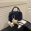 Navy blue square crossbody bag with cylindrical handles and plush white charm - With Pendant / Blue