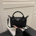 Mini borsa in nylon nero con manico in pelle e tracolla rimovibile su sgabello - Nero