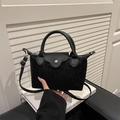 Mini borsa nera in nylon leopardato con patta in pelle e tracolla rimovibile - Leopardo Nero