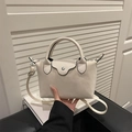 Chic beige mini dumpling bag with top handles and adjustable strap in creamy finish - Leopard White
