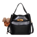 Black glossy bucket bag with golden turn-lock and brown teddy bear charm accessory - With Pendant / Black