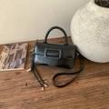 Retro black glossy leather square bag with large buckle on a rustic wooden table - Black with Pendant