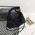 Minimalistische zwarte canvas crossbodytas met trekkoord en brede schouderriem - Zwart