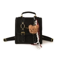 Vintage black backpack with white contrast stitching, gold buckles, and plush bear charm - With Pendant / Black