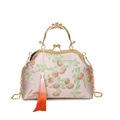 Vintage shell-shaped handbag with persimmon embroidery, gold handle and tassel - Orange
