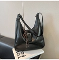 Detail of black wrinkled patent leather hobo bag with braided rope charm and silver buckle - With Pendant / Black
