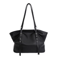 Large black leather tote bag with lychee texture and metallic eyelet belt detail - Black