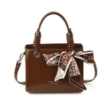 Brown leather crossbody box bag with dual handles and elegant silk scarf accessory - Brown