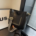 Black bucket bag with geometric jacquard strap and golden rivet pocket details - Black