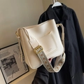 Off-white faux leather bucket bag with bohemian jacquard strap and front pocket - Off White