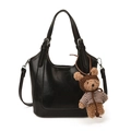 Glossy black leather bucket bag with adjustable strap and cute teddy bear charm detail - With Pendant / Black