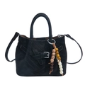 Black V-quilted faux suede handbag with decorative multi-colored beaded tassel charm - Black