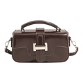 Detail of dark brown structured handbag with silver metal buckle and top handle - With Pendant / Brown