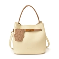 Off-white lychee leather bucket bag with brown handles and a cute bear charm - White