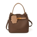 Brown lychee leather bucket bag with top handle and cute bear charm accessory - Brown