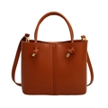 Elegant brown leather bucket bag with gold hardware and adjustable crossbody strap - Brown