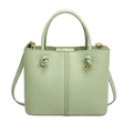 Elegant light green leather bucket bag with gold hardware and knotted strap details - Green