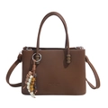 Brown tote bag with vertical stripes, colorful beaded charm, and removable strap - Brown