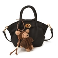 Black litchi leather bucket bag with gold hardware and brown teddy bear charm accessory - With Pendant / Black