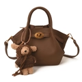 Dark brown lychee texture leather bucket bag with gold lock and woven bear charm - With Pendant / Brown