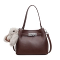 Dark brown pebble leather bucket bag with silver twist lock and plush rabbit pendant - With Pendant / Brown