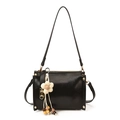 Black rectangular shoulder bag with golden rivets and floral beaded bag charm detail - With Charm / Black
