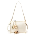 White minimalist crossbody bag with floral pendant and golden metal zipper hardware - With Charm / White