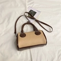 Chic beige canvas Boston handbag with brown leather trim and adjustable crossbody strap - Khaki