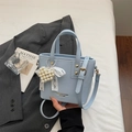 Light blue mini bucket bag with pearl heart charm and lace bow on grey suit fabric - With Pendant / Blue