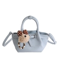 Light blue pleated bucket bag with plush bear charm and colorful beaded handle strap - With Charm / Blue