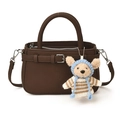 Dark brown pebble leather crossbody bag featuring a cute plush bear charm with blue hat - Brown