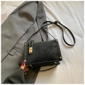 Retro black suede crossbody bag with gold buckle and contrast stitching accents - Black