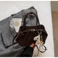 Minimalist dark brown suede tote bag featuring a decorative cream horse charm accessory - Coffee