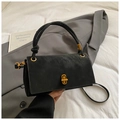 Elegante borsa nera in ecopelle con chiusura a scatto dorata e manico annodato unico - Nero