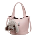 Pink lychee leather bucket bag with silver hardware and cute rabbit plush charm - Pink