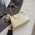 Beige patent leather shoulder bag with gold chain strap and cute bear charm accessory - With Pendant / Yellow