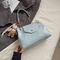 Light blue patent leather shoulder bag with gold chain strap and teddy bear charm - With Pendant / Blue