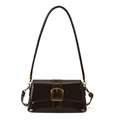 Detail of dark brown patent leather shoulder bag with glossy finish and gold metal buckle - Brown
